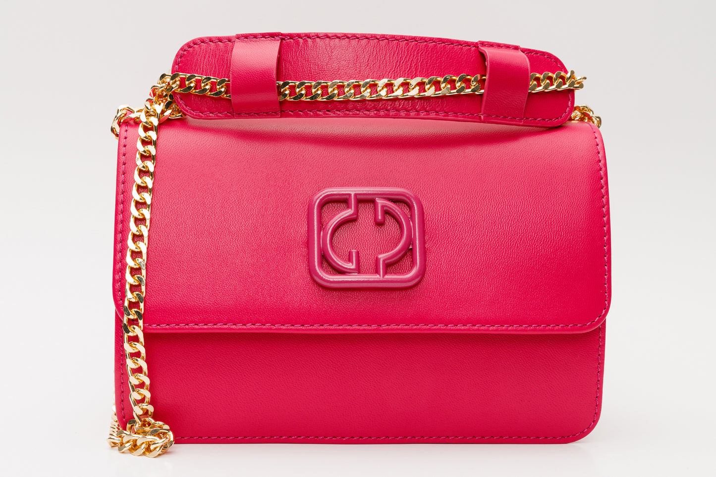 El bolso de mano de piel fucsia Maneadero