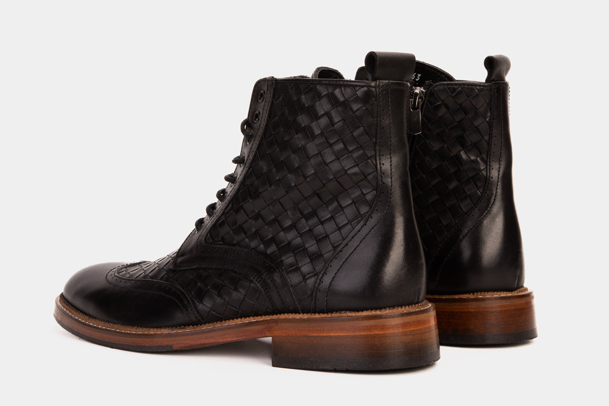 Bota de hombre Loddon de cuero negro con punta de ala, brogue, tejida a mano, con cordones y cremallera